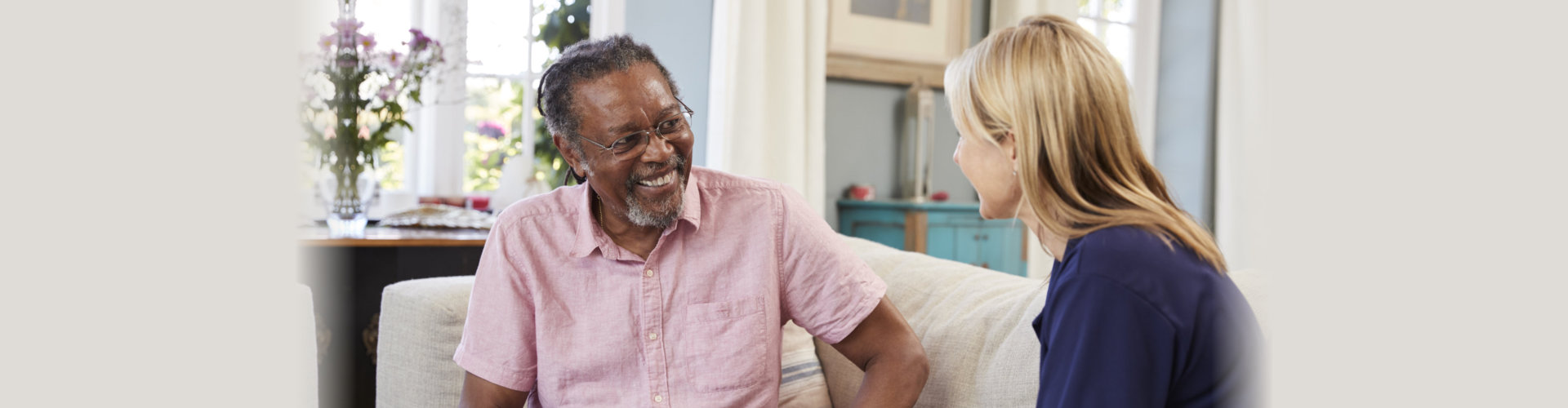 Female Support Worker Visits Senior Man At Home