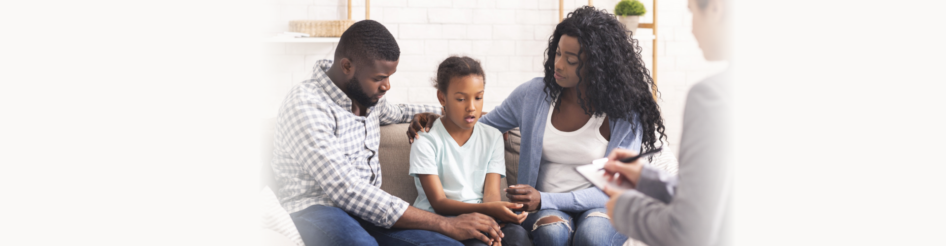 Little girl and her parents at reception of psychologist